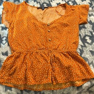 I’m selling an orange crop top, the brand is one ❤️clothing. I do Venmo!